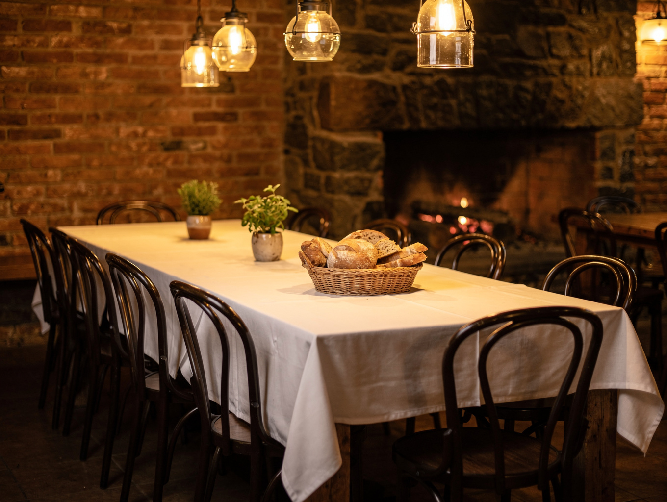 Warm Italian dining room with vaulted ceilings and rustic wooden seating